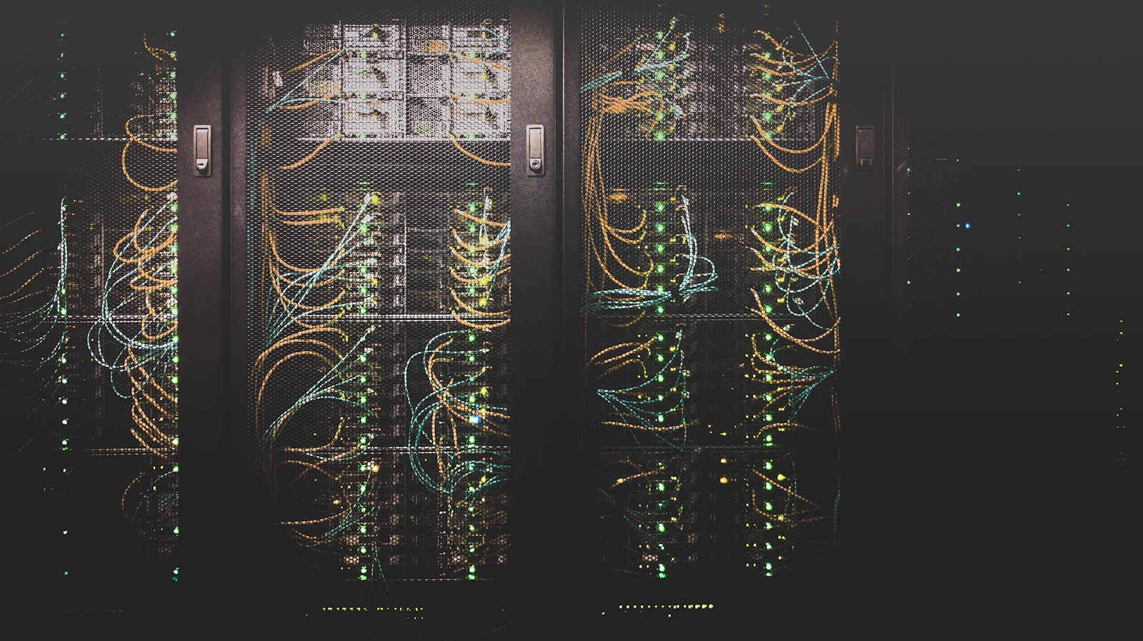 A network rack neatly patched with colour-coded cabling